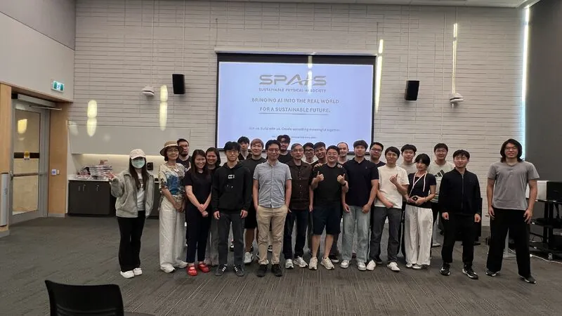 Students and guests gathered in front of the SPAIS presentation screen at the intro event.